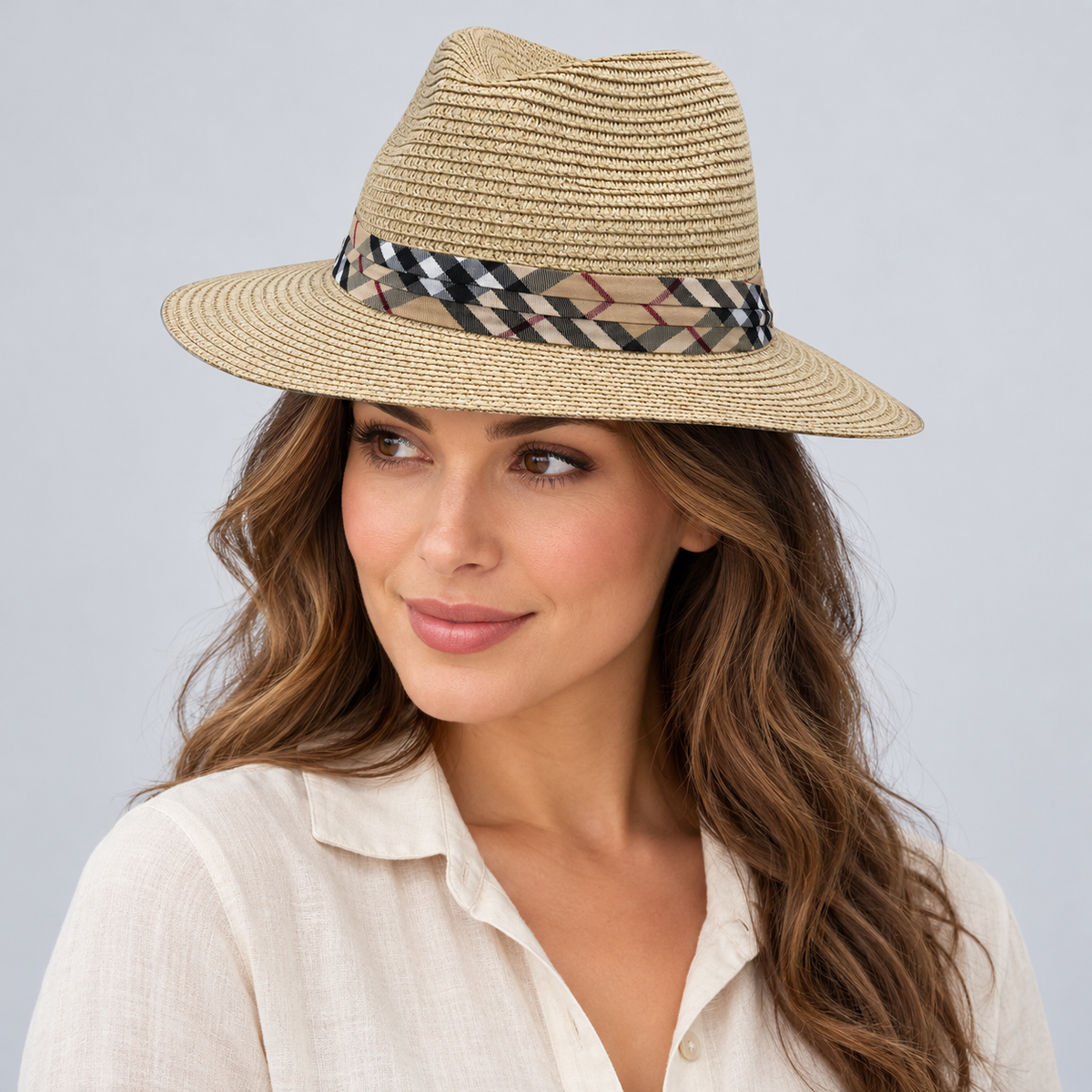 Model wearing the beige woven fedora with checked band