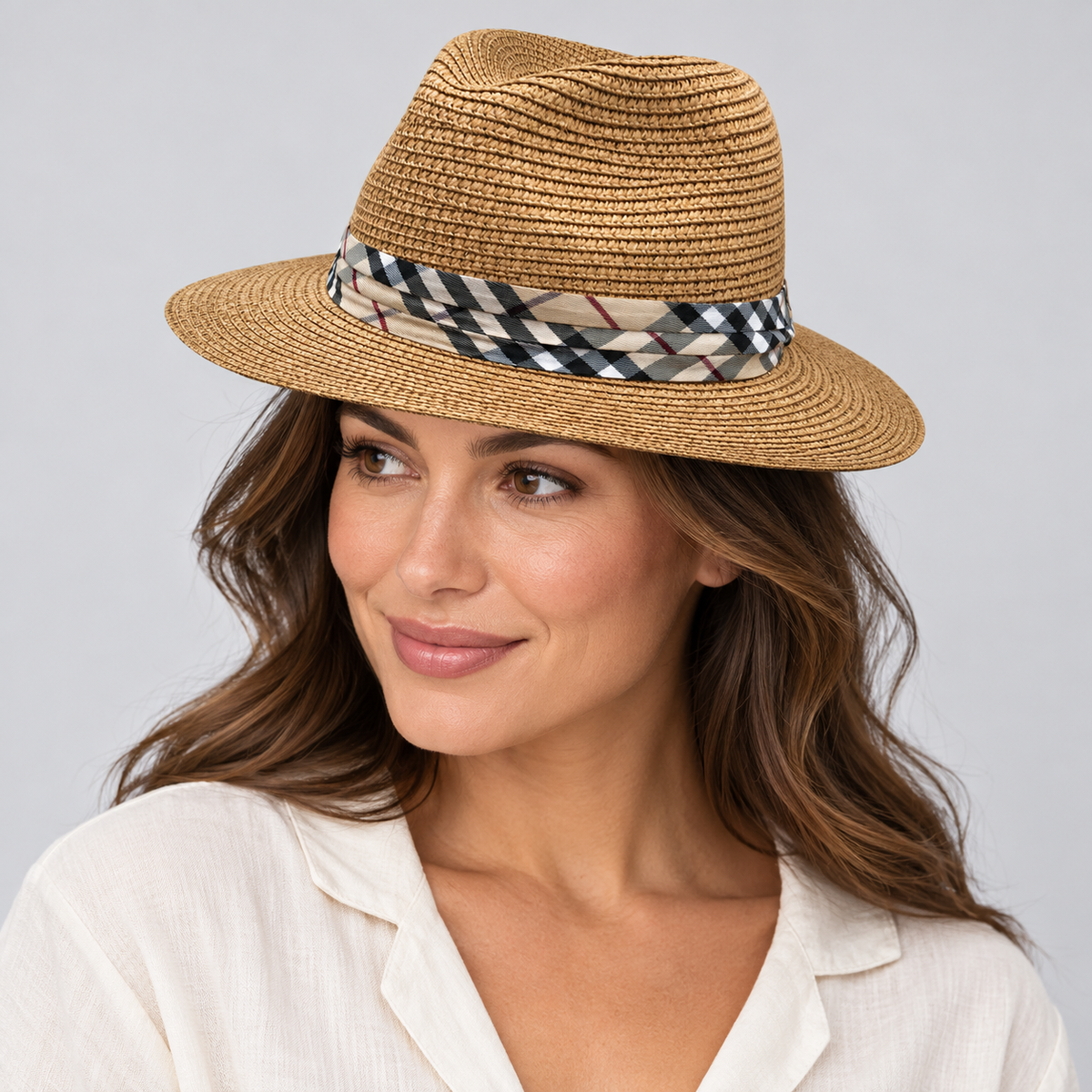 Model wearing the camel woven fedora with checked band