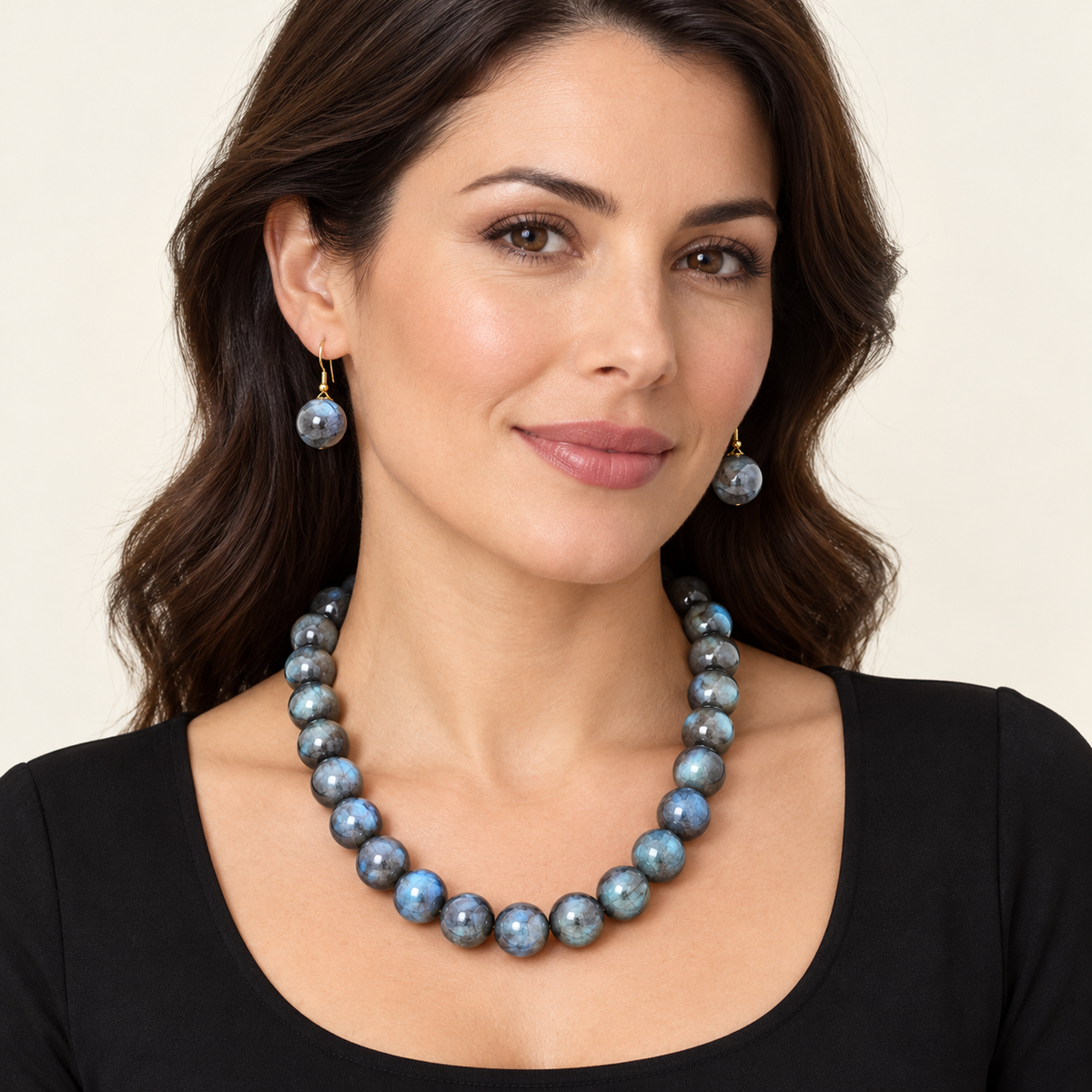 Black KS2316 marbled bead necklace and matching earrings shown on an AI-generated model